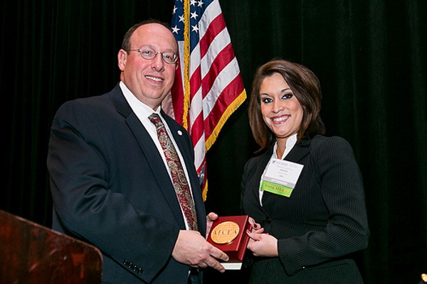 Cusano presents a Distinguished Young AFCEAN Award to Jessica Gressett in December.